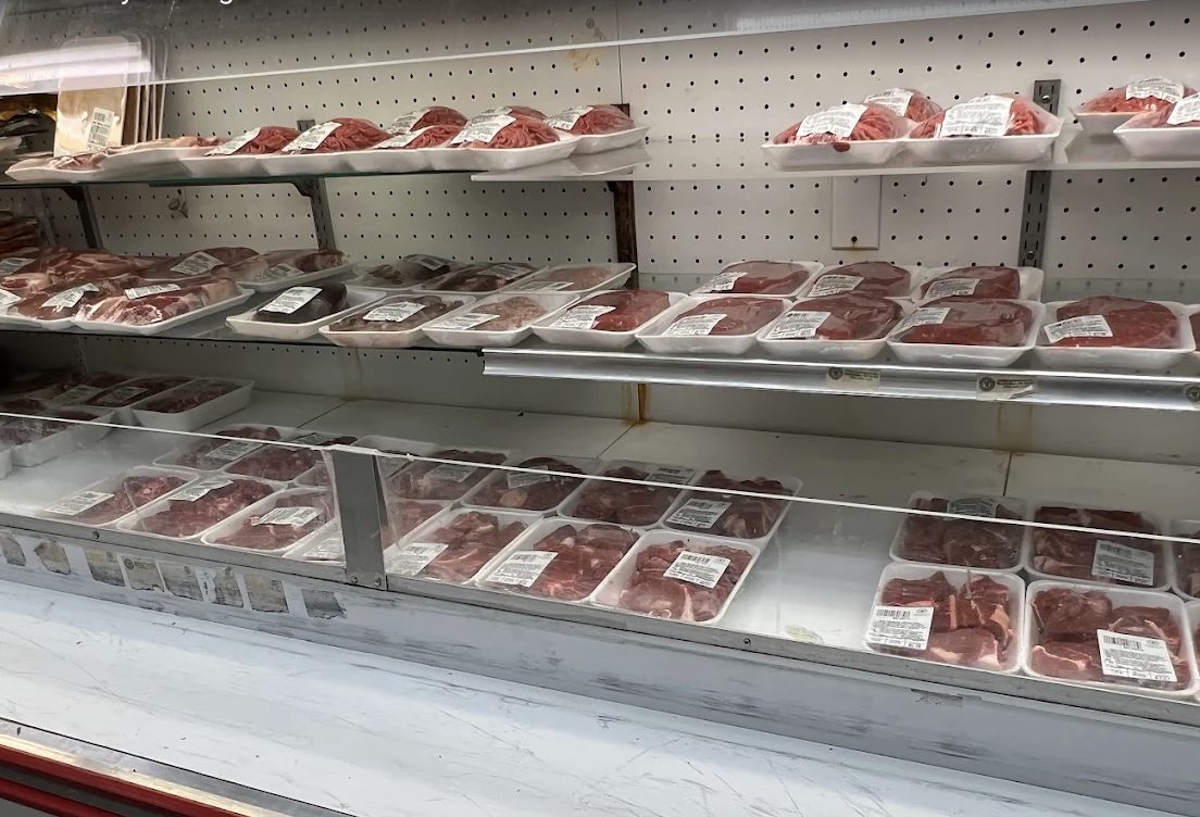 Fresh halal meat cuts displayed in the refrigerated counter at Fair Price